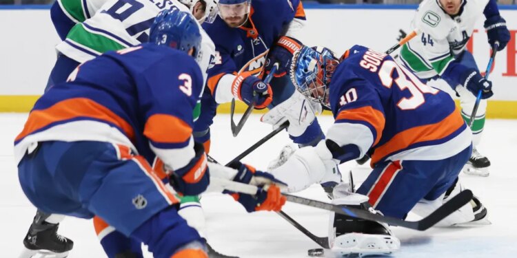 New York Islanders goaltender Ilya Sorokin (30) makes a save during the second period of a game against the Vancouver Canucks at UBS Arena in Elmont, N.Y. on Friday, Dec. 19, 2025.