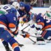 New York Islanders goaltender Ilya Sorokin (30) makes a save during the second period of a game against the Vancouver Canucks at UBS Arena in Elmont, N.Y. on Friday, Dec. 19, 2025.