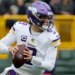 Minnesota Vikings quarterback J.J. McCarthy (9) looks to pass.