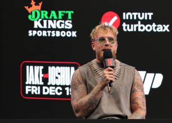 Jake Paul speaks to reporters during a press conference announcing his heavyweight boxing match against Anthony Joshua at Kaseya Center on Nov. 21, 2025.