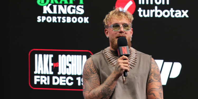 Jake Paul speaks to reporters during a press conference announcing his heavyweight boxing match against Anthony Joshua at Kaseya Center on Nov. 21, 2025.