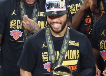 Jalen Brunson #11 of the New York Knicks is all smiles after he is presented with the NBA Cup MVP trophy after winning the NBA Cup.