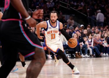 New York Knicks guard Jalen Brunson drives down court with the basketball.