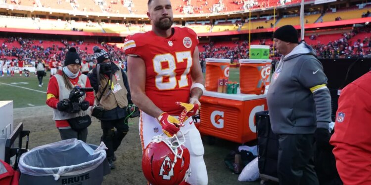 Kansas City Chiefs tight end Travis Kelce walks off the field after an NFL football game.