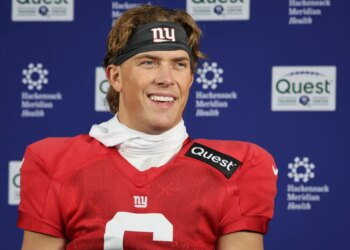 Giants quarterback Jaxson Dart talks with reporters earlier this month.