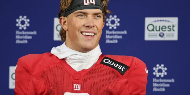 Giants quarterback Jaxson Dart talks with reporters earlier this month.