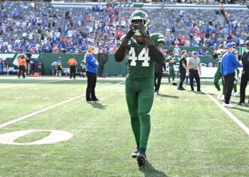 Jets linebacker Jamien Sherwood (44) comes off the field after a loss.