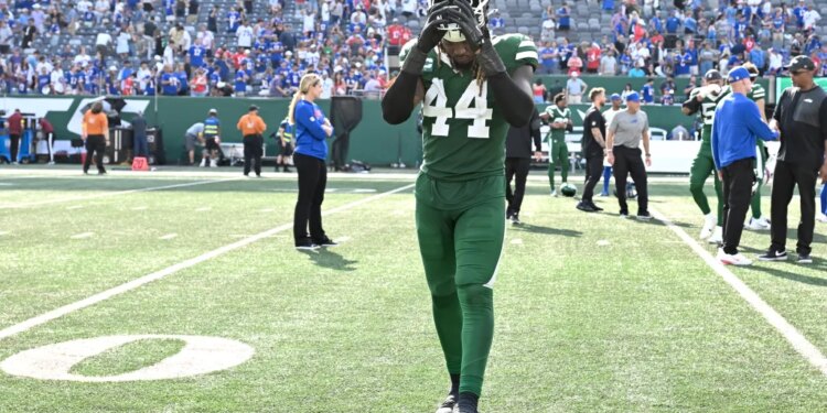Jets linebacker Jamien Sherwood (44) comes off the field after a loss.
