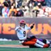 Cincinnati Bengals quarterback Joe Burrow (9) throws as he is tackled by Baltimore Ravens linebacker Kyle van Noy during the second half of an NFL football game, Sunday, Dec. 14, 2025, in Cincinnati.