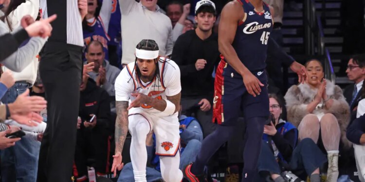 New York Knicks guard Jordan Clarkson #00 reacts after he hits a three-point shot during the fourth quarter.