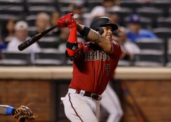 Ketel Marte of the Arizona Diamondbacks hits an RBI double.