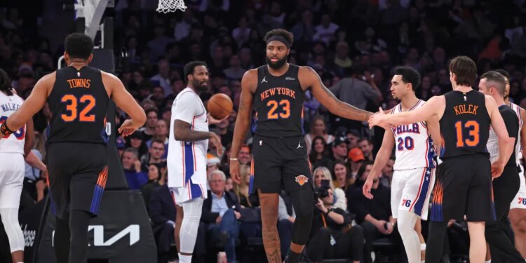 New York Knicks center Mitchell Robinson #23 is greeted by New York Knicks guard Tyler Kolek #13 after being fouled during the second quarter.