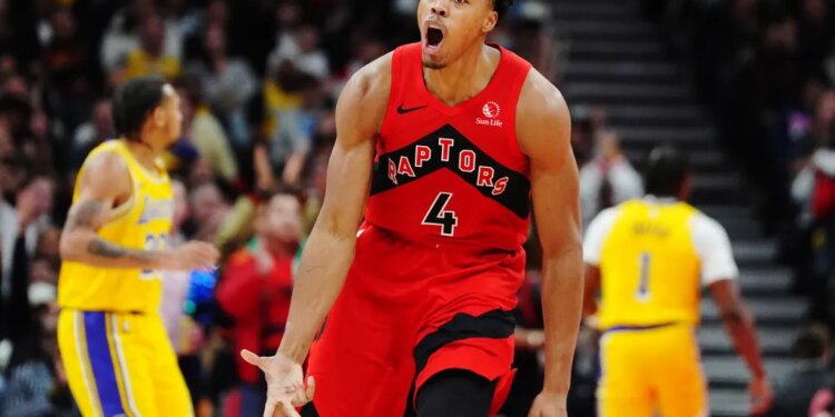 Scottie Barnes of the Toronto Raptors celebrating after a basket against the Los Angeles Lakers.