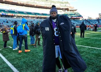 Baltimore Ravens quarterback Lamar Jackson (8) walks off the field after a win against the Cincinnati Bengals.
