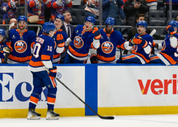 New York Islanders right wing Simon Holmstrom (10) celebrates his goal against the New Jersey Devils during the second period at UBS Arena.