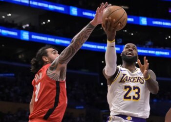 Rockets center Steven Adams, left, blocks a shot by Lakers forward LeBron James during the second half on Dec. 25, 2025.