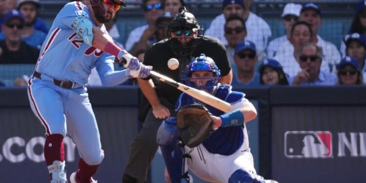 Philadelphia Phillies' Kyle Schwarber hits a double against the Los Angeles Dodgers.