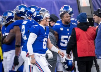 New York Giants quarterback Jaxson Dart #6 walks to the sideline during the second half.