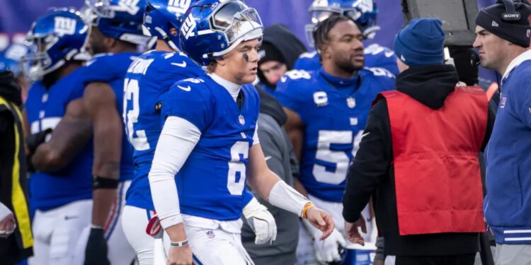 New York Giants quarterback Jaxson Dart #6 walks to the sideline during the second half.