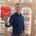 McDonald's CEO Chris Kempczinski holding a Happy Meal box.