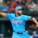 Texas Rangers starting pitcher Merrill Kelly throws a pitch during the first inning of a baseball game against the Miami Marlins on Sunday, Sept. 21, 2025, in Arlington, Texas.
