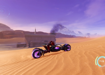 Screenshot from Metroid Prime 4 featuring Samus in the desert on a futuristic bike with a smoking ruin in the background.