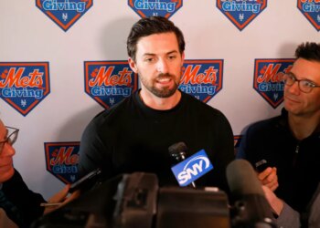Clay Holmes speaking at the New York Mets Annual Kids Holiday Party.