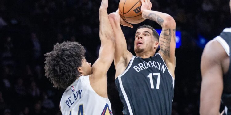 Michael Porter Jr. #17 of the Brooklyn Nets goes up for a shot as Micah Peavy #14 of the New Orleans Pelicans defends during the second half at Barclays Center, Saturday, Dec. 6, 2025, in Brooklyn, NY.