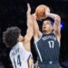 Michael Porter Jr. #17 of the Brooklyn Nets goes up for a shot as Micah Peavy #14 of the New Orleans Pelicans defends during the second half at Barclays Center, Saturday, Dec. 6, 2025, in Brooklyn, NY.