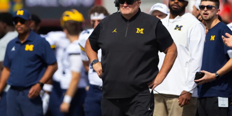 Michigan acting head coach Biff Poggi watches as his team plays against Nebraska during the first half of an NCAA college football game Saturday, Sept. 20, 2025, in Lincoln, Neb.
