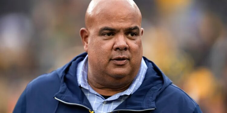 Warde Manuel watches in the second half of an NCAA college football game against UNLV in Ann Arbor, Mich., Sept. 9, 2023.