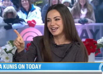 Mila Kunis on TODAY show, pointing and smiling.