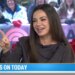 Mila Kunis on TODAY show, pointing and smiling.