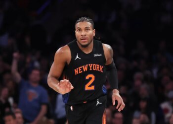New York Knicks guard Miles McBride reacts after scoring a 3-point basket.