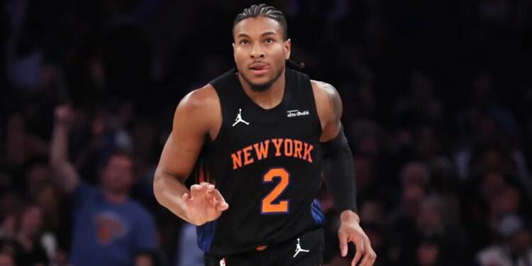 New York Knicks guard Miles McBride reacts after scoring a 3-point basket.