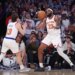 Mitchell Robinson #23 passes the ball to New York Knicks guard Tyler Kolek #13 during the fourth quarter.