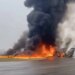 A private jet crashed and burst into flames on a runway.