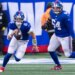 New York Giants quarterback Jaxson Dart running with the ball.