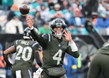 New York Jets quarterback Brady Cook #4 throws a pass during the third quarter.