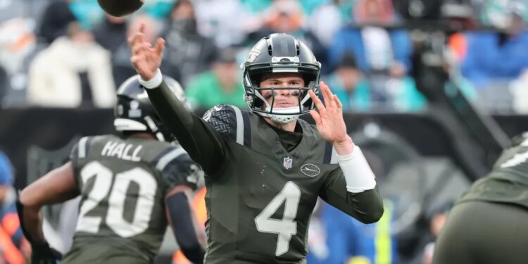 New York Jets quarterback Brady Cook #4 throws a pass during the third quarter.