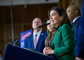 Governor Kathy Hochul speaking at a podium during the SPARC Kips Bay groundbreaking.