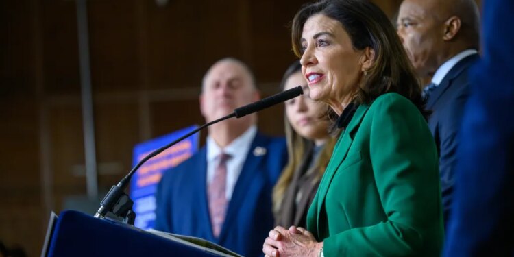 Governor Kathy Hochul speaking at a podium during the SPARC Kips Bay groundbreaking.
