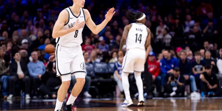 Brooklyn Nets' Egor Demin reacts to the three-point basket during the second half of an NBA basketball game against the Philadelphia 76ers, Tuesday, Dec. 23, 2025, in Philadelphia.