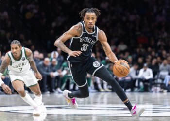 Nic Claxton dribbles up court during the Nets' blowout win over the Bucks on Dec. 14, 2025.