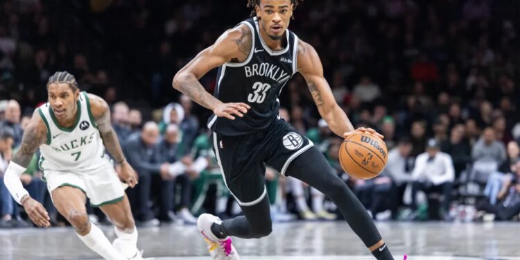 Nic Claxton dribbles up court during the Nets' blowout win over the Bucks on Dec. 14, 2025.