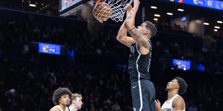 Michael Porter Jr. #17 of the Brooklyn Nets slams the ball during the second half at Barclays Center.