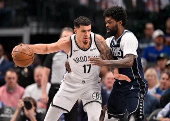 Brooklyn Nets forward Michael Porter Jr. (17) looks to move the ball past Dallas Mavericks forward Naji Marshall (13) during the game between the Mavericks and the Nets at the American Airlines Center.