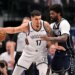 Brooklyn Nets forward Michael Porter Jr. (17) looks to move the ball past Dallas Mavericks forward Naji Marshall (13) during the game between the Mavericks and the Nets at the American Airlines Center.
