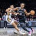 Nic Claxton #33 of the Brooklyn Nets drives pass Bryce McGowens #11 of the New Orleans Pelicans during the second half at Barclays Center, Saturday, Dec. 6, 2025, in Brooklyn, NY.