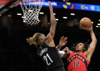 Brooklyn Nets forward Noah Clowney (21) blocks a shot by Toronto Raptors’ Collin Murray-Boyles (12) at the Barclays Center.